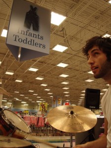 Is Darrin and infant or a toddler? I mean, he IS a drummer...